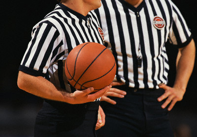 Two Basketball Referees --- Image by © Royalty-Free/Corbis